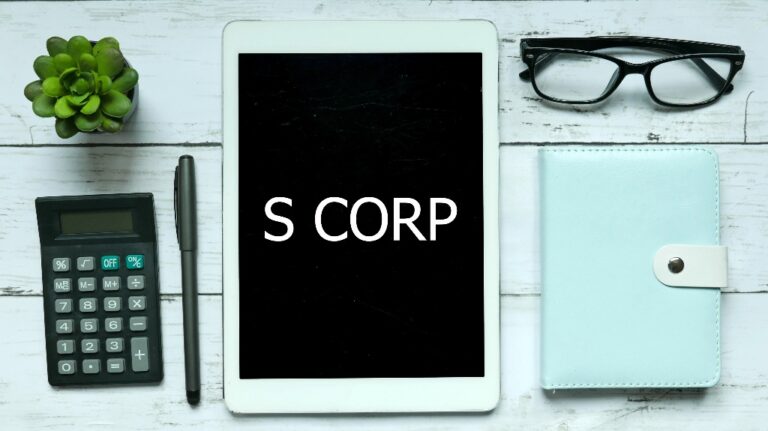 Top view of plant,calculator,glasses,pen,notebook and tablet written with S Corp