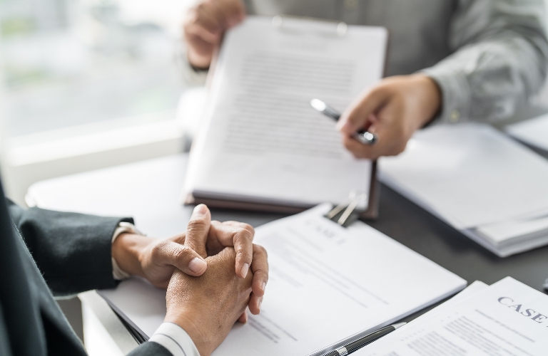 lawyer is reviewing documents with the client