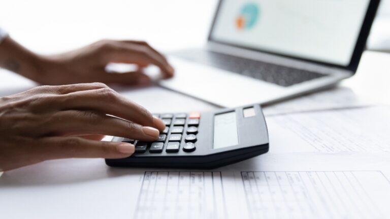 woman using calculator