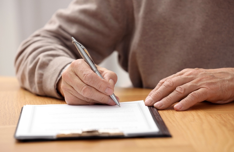 Senior man is signing last will