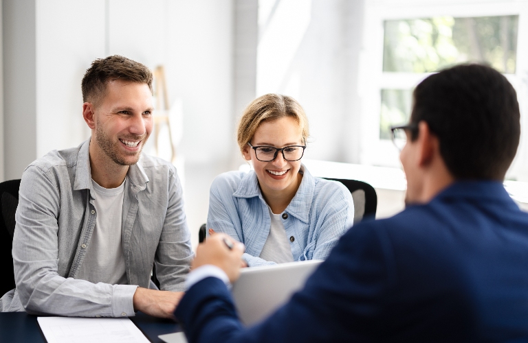 Young couple is consulting about esstate planning with lawyer
