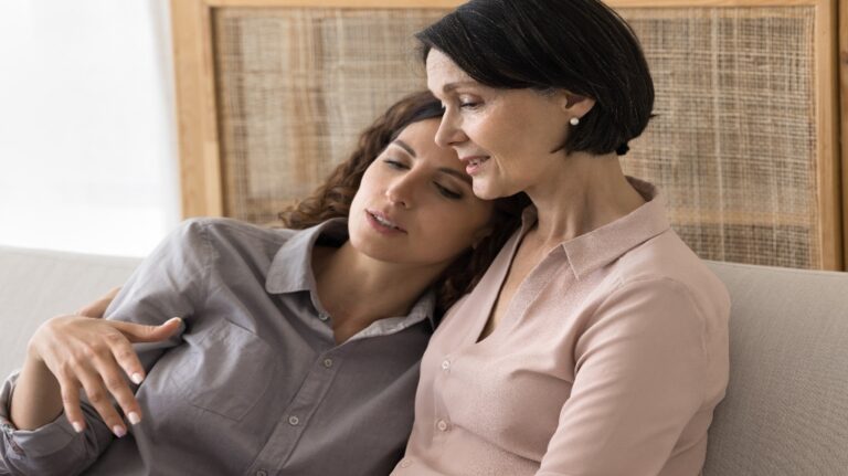 mother comforting daughter