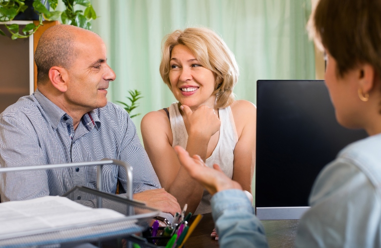 couple and attorney speaking about will