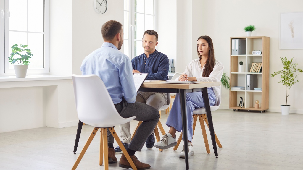 Lawyer is consulting family couple about estate planning