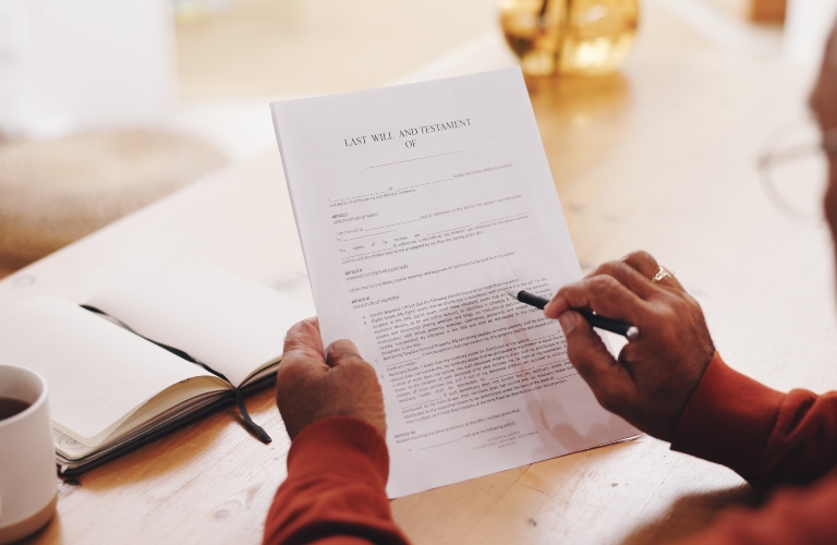 Hands, person and document for will at house with pen